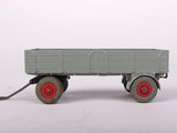a toy truck that is sitting on a white surface