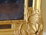 a picture of a gold picture frame on a white table