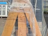 a man riding a skateboard on a wooden ramp