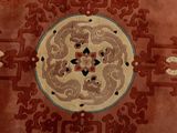 a large oriental rug with a circular design on it