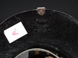 a black hat with a white tag on it