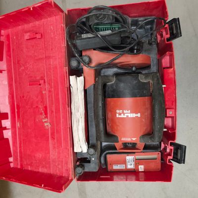 a red tool box with a red drill and other tools in it
