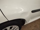 a close up of a white car with a black door handle