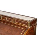 a wooden desk with a marble top and drawers