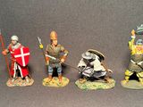 seven figurines of knights in different poses