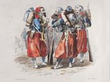 two men dressed in medieval clothing standing next to each other