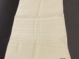 a close up of a white towel on a table