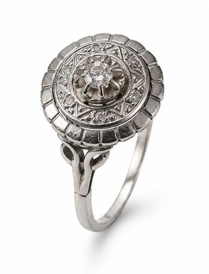 a close up of a diamond ring on a white background