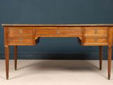 an antique desk with drawers and a marble top
