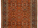 an orange and black rug with fringes on a white background