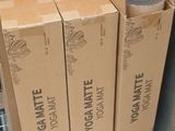 several boxes of food are stacked on a metal shelf in a store