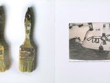 an open book with a brush and a picture of a drum