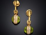a pair of peridot and diamond earrings
