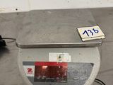 an image of a scale with a price tag on it