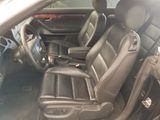 a picture of the interior of a car with leather seats