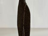 a black vase that has a white line on it