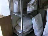a shelf with bags and bags on it in a room