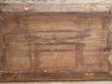a picture of a wooden sign hanging on a wall