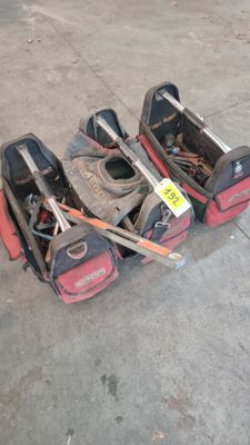 three lawn mowers that are laying on the ground