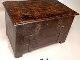 a small wooden box with a pair of scissors next to it