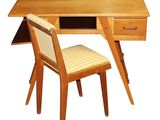 a wooden desk with a chair next to it
