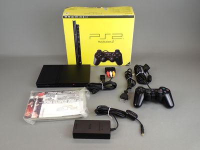 a box with a game controller and other items on the table