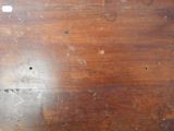 a wooden table with a hole in the middle of it