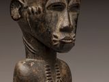 a close up of a statue of a person with a head