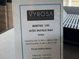 a picture of a sign on a table in front of a window