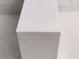 a white box sitting on the floor next to a toilet