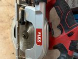 a corded circular saw and a circular circular saw on a table