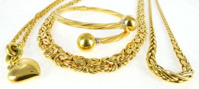gold plated necklace, bracelet, and ring set with a heart charm