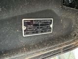 a close up of a metal plate on a car ' s dashboard