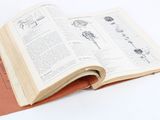 an open book that is sitting on a table