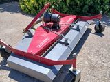 an image of a lawn mower sitting on the ground