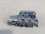 a toy truck that is sitting in the sand