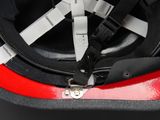 a close up of a helmet on a red and black surface