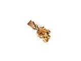 une image représentant un pendentif en or orné d'une fleur