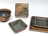 three bowls and a plate on the table