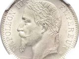 a close up of a coin with a man ' s face on it