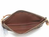 the inside of a brown purse with a zipper on it