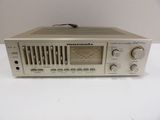a close up of a radio on a table with a white background
