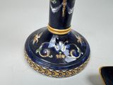 a blue and gold vase with a dragon on it
