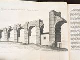 an open book with a drawing of a bridge in it