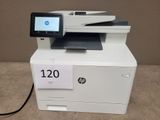 the printer is sitting on top of the table with a price tag on it