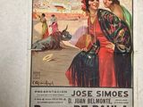 a poster on the wall of a building advertising a show