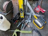 a lot of tools that are laying out on the ground