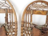 two snowshoes that are sitting side by side