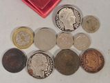 a lot of coins that are sitting on a table
