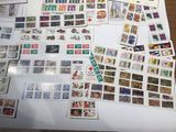 many different stamps on a table with a lot of them
